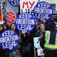 Pro-choice activists shout slogans before the annual March for Life passes by the U.S. Supreme Court in Washington, D.C., on Jan. 22, 2015.
Alex Wong/Getty Images